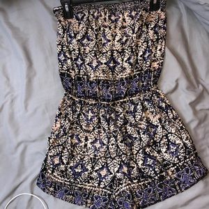 Cute tan, black, and purple romper